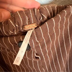 free people pinstripe pants in a chocolate brown with cream stripes